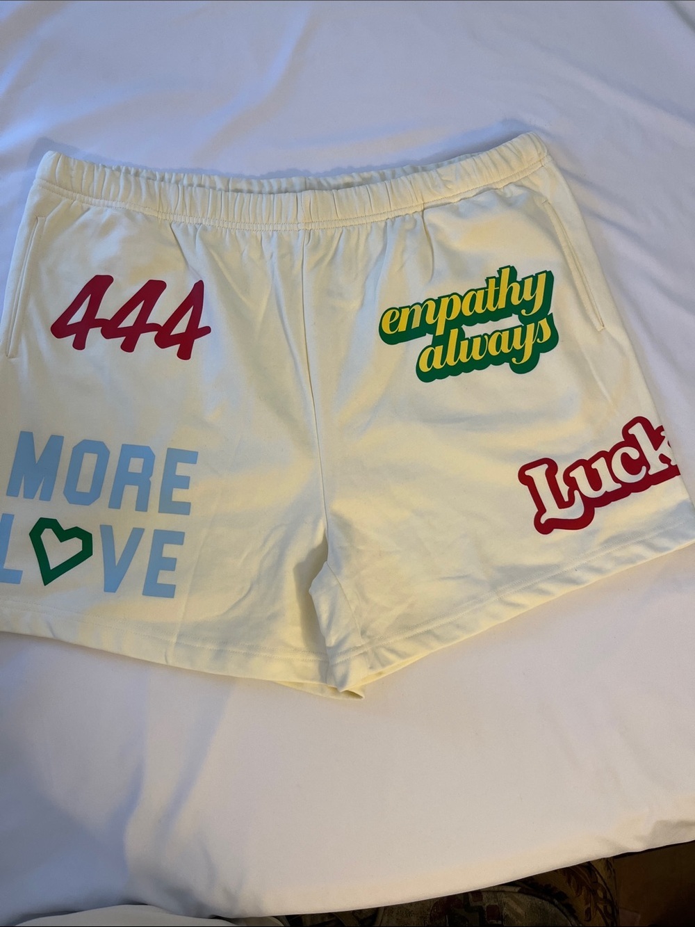 Cream Graphic Athletic Shorts for Women - Empathy Always